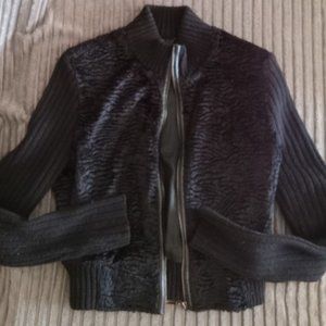 Faux fur body waist length, sleeves are blend zip-up jacket